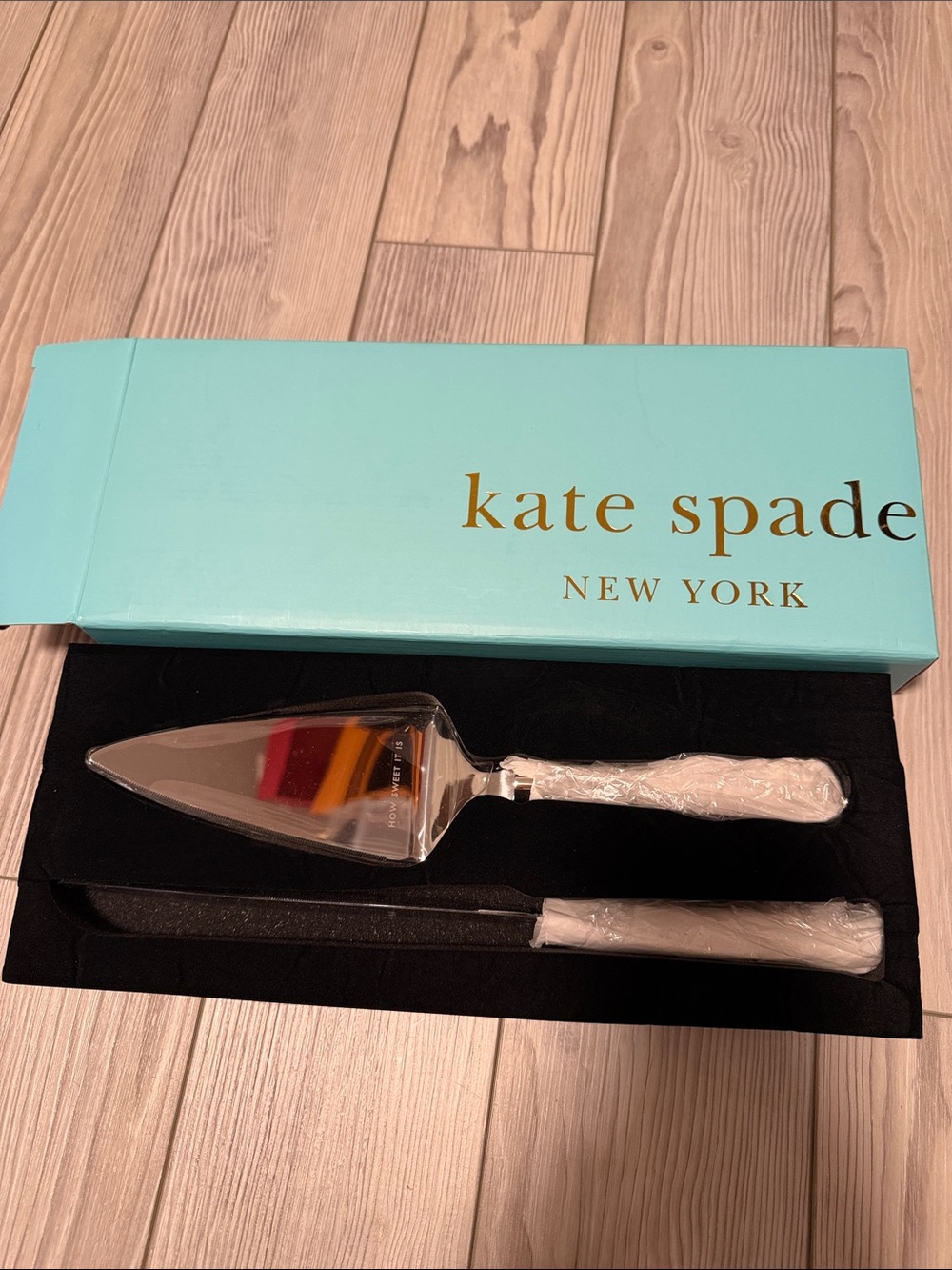kate spade turquoise box with white-handled cake server and knife set